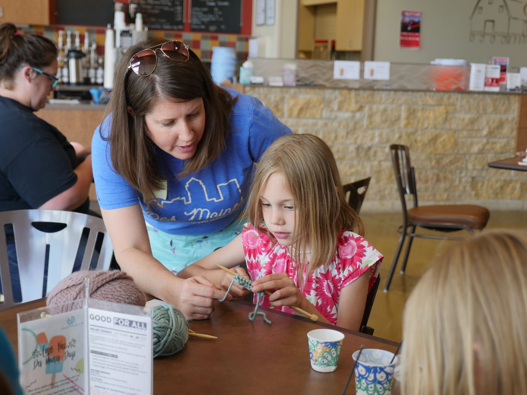A volunteer serving in the café