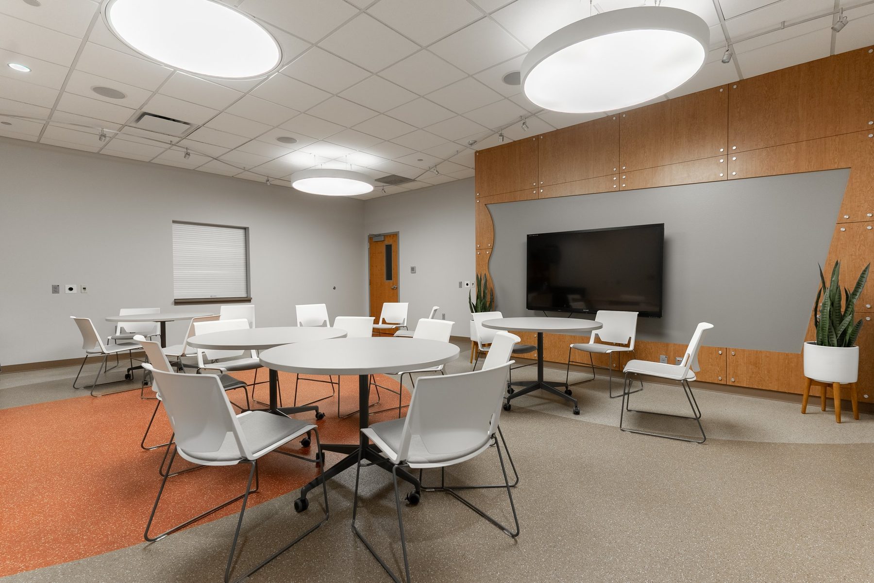 The Hideaway, a casual meeting room with bistro tables