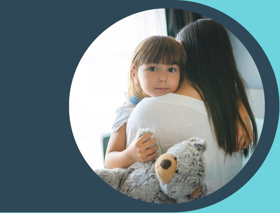 A child holding a stuffed animal