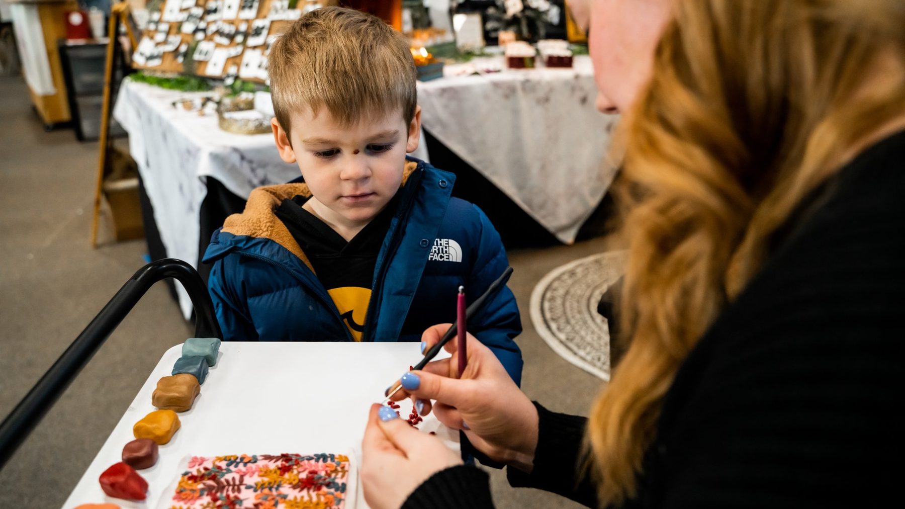 Vendors and shoppers at the Local Holiday Makers Market