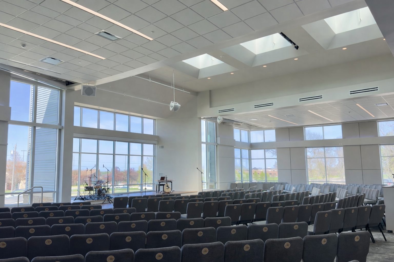 The Sky Venue, a tall room with skylights and floor-to-ceiling windows